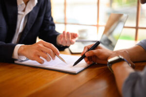 Two people reviewing legal documents.