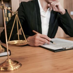 Lawyer reviewing legal documents at desk