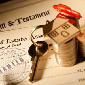 Estate planning paperwork with house key and coins