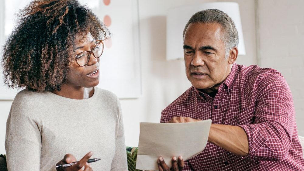 Couple reviewing their will documents together