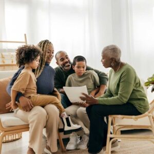 Multigenerational family reviewing financial documents together at home.